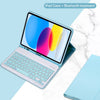 A light blue iPad case with a Bluetooth keyboard attached, shown on a white marble surface.