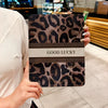 A leopard print protective case for an iPad, featuring a brown and black pattern with the text GOOD LUCKY.