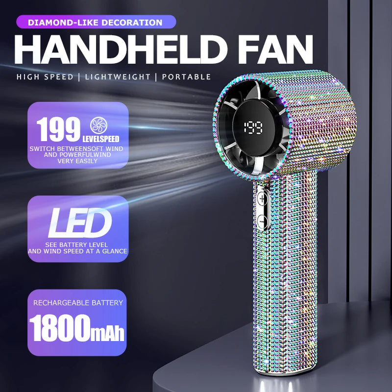 A sparkling diamond-like handheld fan with a LED display and rechargeable battery is shown on a dark surface.