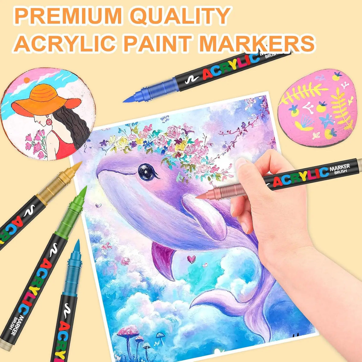 A hand paints a purple dolphin illustration on paper using premium quality acrylic paint markers.
