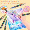 A hand paints a purple dolphin illustration on paper using premium quality acrylic paint markers.