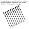 Flexible rods and clamps used to secure model parts to a metal box for adjustment.