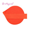 Orange adjustable spandex elastic hair ties and trims rolled into a flat band