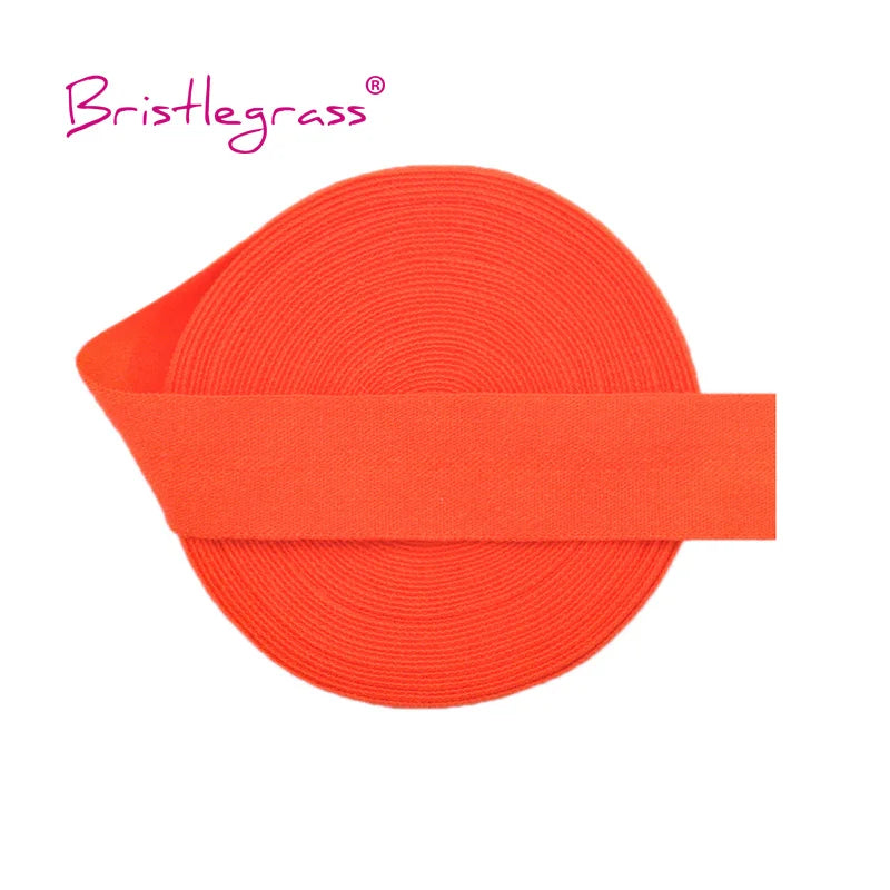 Orange adjustable spandex elastic hair ties and trims rolled into a flat band