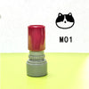 A teacher stamp with a cat face design in black and white, featuring a red top and gray base.