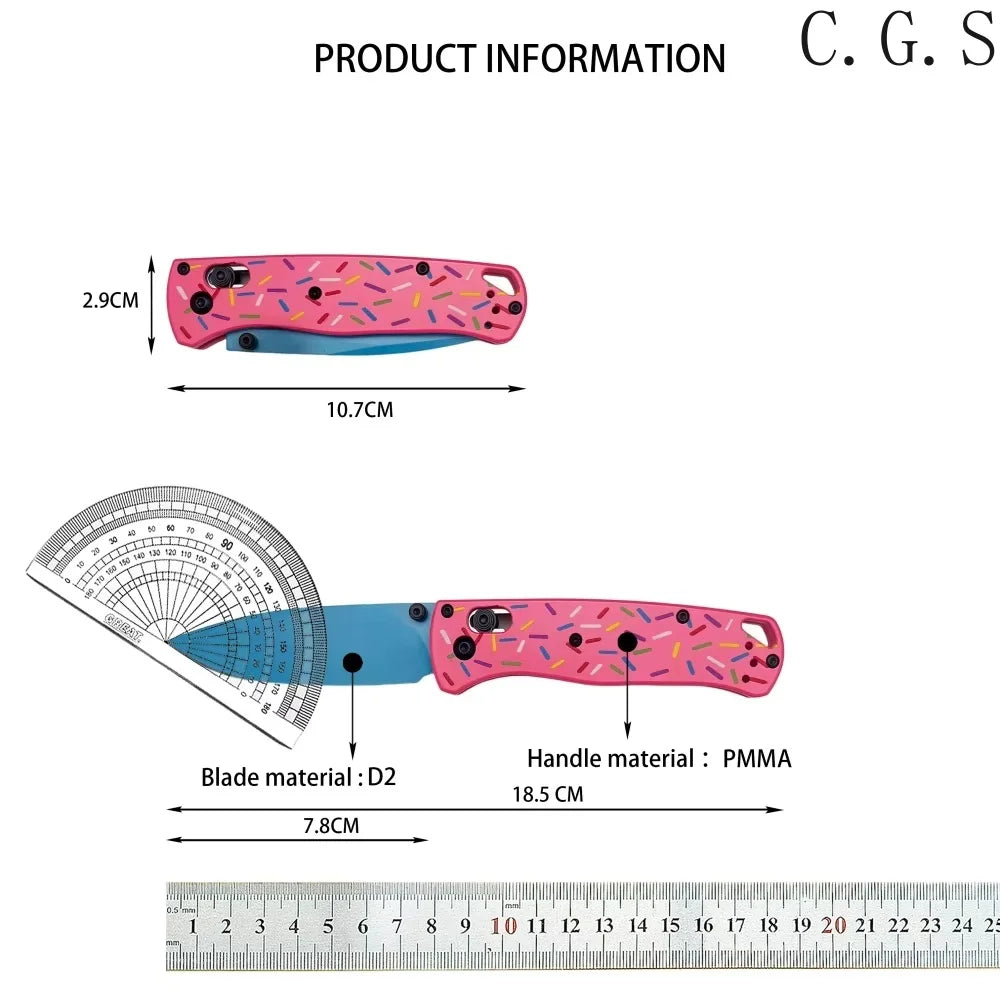 Pink donut acrylic folding knife with a D2 steel blade shown next to a ruler.