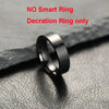 A close-up shot of a silver decoration ring lying on a dark surface.