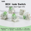 A set of green and white BOX Jade Switch clicky switches shown with operating force and travel specifications.