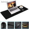 A black mouse pad with a leather-like texture is shown next to a laptop and a mouse.