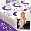 A stack of transparent protective card sleeves with purple and white designs is shown.