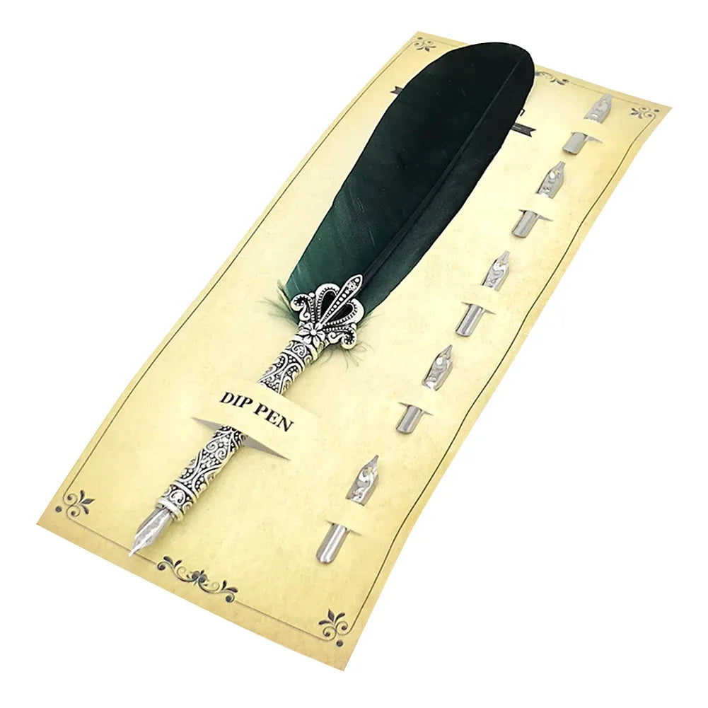 A feather dip pen set with a dark green feather and various nibs displayed in a light yellow box.