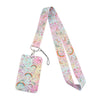 A pink and purple patterned fabric lanyard with a clear plastic tag attached.