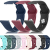 Eine Sammlung von Silikon-Armband-Uhrenbändern in verschiedenen Farben und Finishes auf weißem Hintergrund.