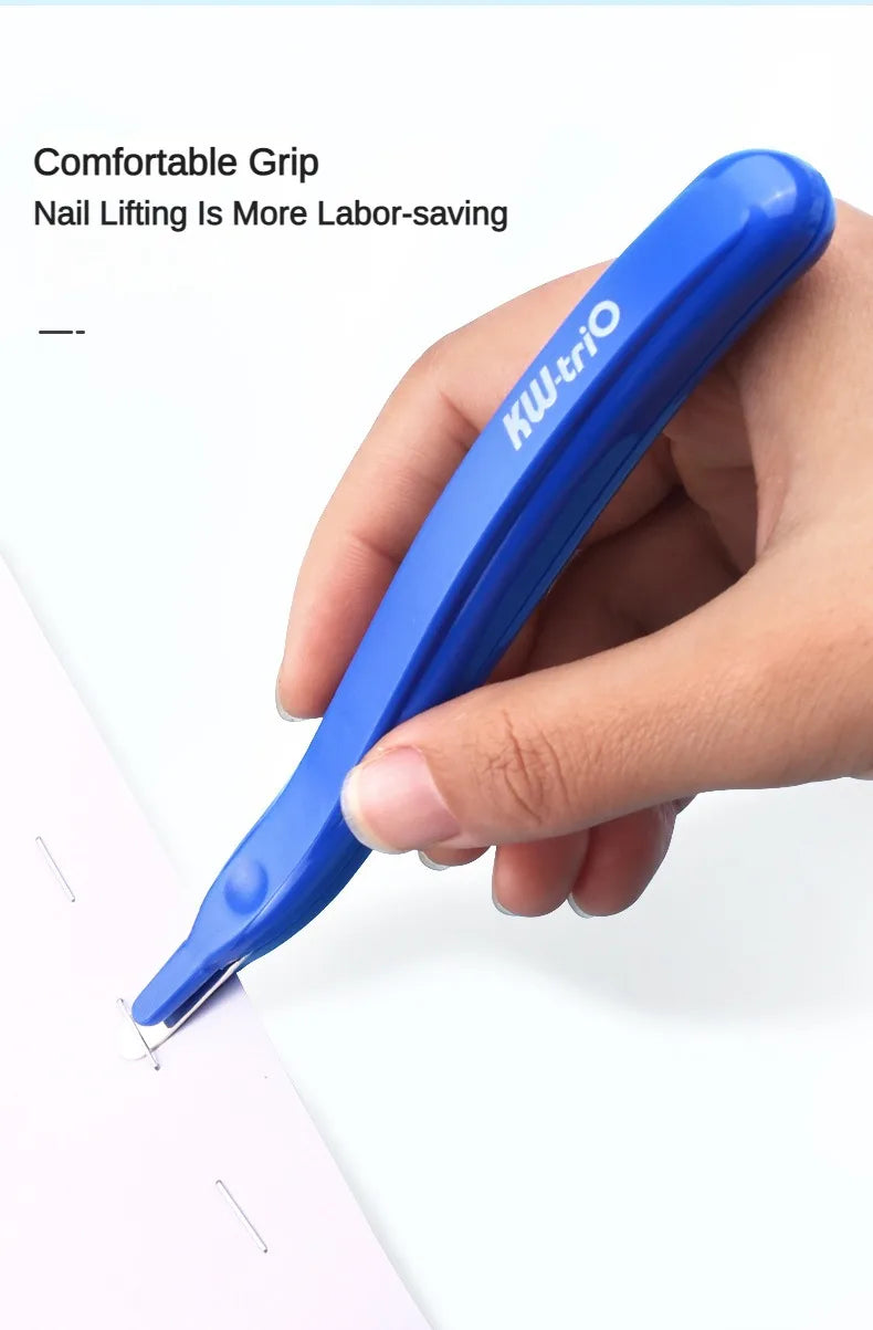 A hand holds a blue portable magnetic staple remover tool against a white surface.
