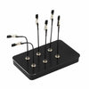 A black magnetic painting stand with four vertical holders for art and craft tools.