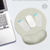 A light beige ergonomic wrist support mouse pad is shown next to a laptop, highlighting an ultra smooth Lycra surface for imp