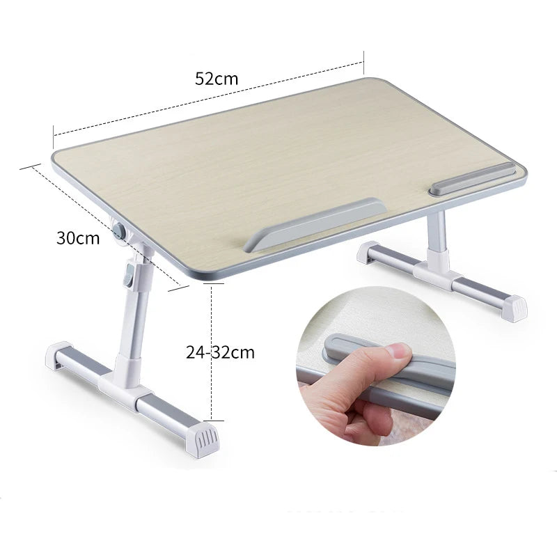 A portable adjustable laptop desk stand with a light wood-colored surface and silver metal frame.
