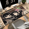 A gaming mouse pad featuring an illustration of Andy and Leyley from The Coffin of Andy and Leyley.