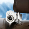 A white clip-on car fan with a digital display showing 58 percent battery life mounted on a brown leather surface.