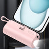 A pink portable power bank with an LED light and charging port is shown next to a smartphone screen.