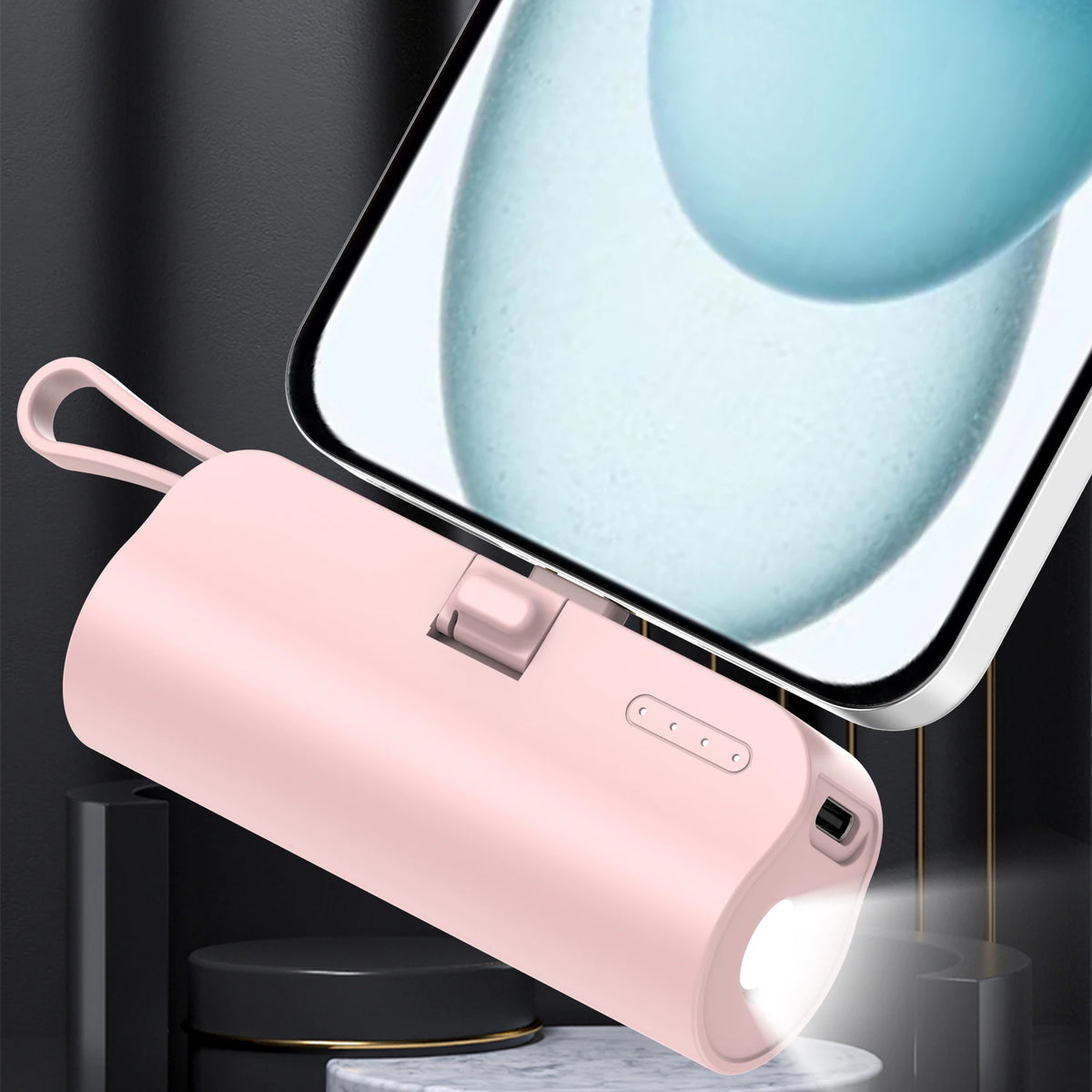 A pink portable power bank with an LED light and charging port is shown next to a smartphone screen.