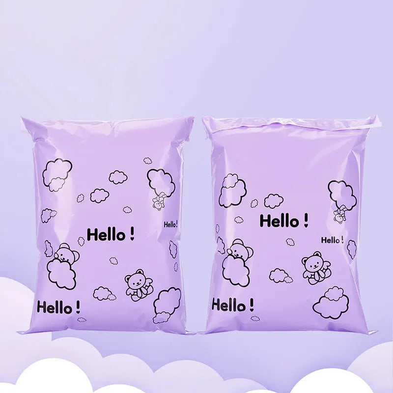 Two purple reusable plastic mailing bags filled with white cloud-shaped stickers.