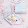 A white keycap puller is shown with pink cat paw and heart themed keycaps resting inside, next to the packaging box.