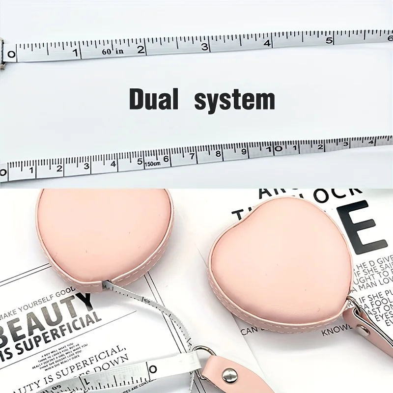 Pink PU leather measuring tape with a dual system shown next to a ruler.