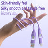 A hand holds a purple silky smooth tangle-free charging cable with a connector.