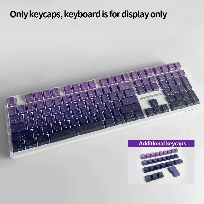 A white keyboard featuring purple and dark blue PBT keycaps, with additional keycaps shown below.