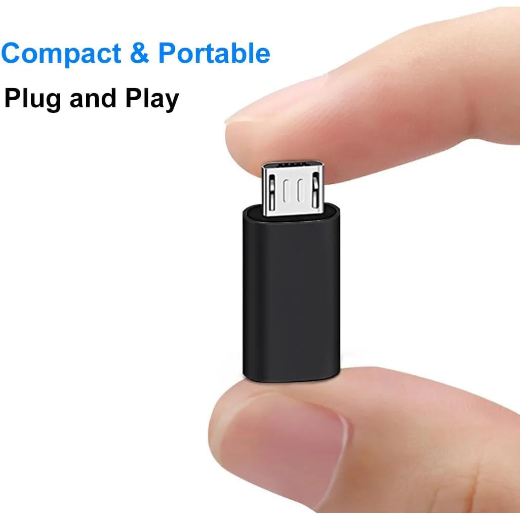 A hand holds a black USB-C to Micro USB adapter plugged into a device.