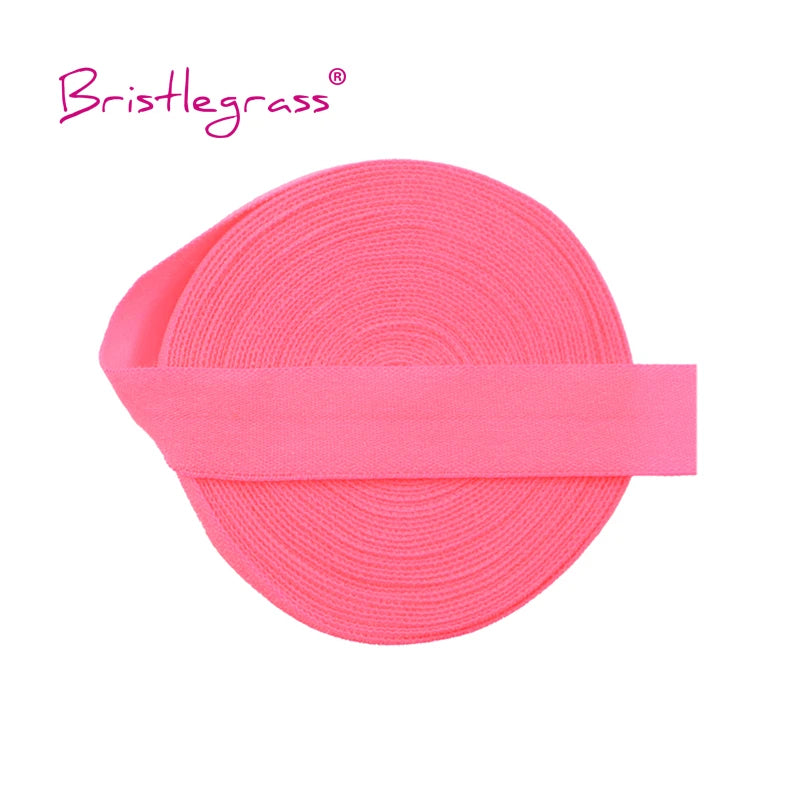 Pink bristleglass elastic hair ties and trims rolled into a flat band