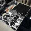 Black and white illustration of a fierce character on an oversized mouse pad for gaming or office use.
