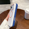 A white and blue magnetic wireless charging phone case is held above a wooden table.