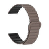 A close-up view of a brown adjustable magnetic loop watch band.