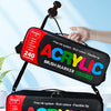 A black acrylic paint marker set is shown in two modes: one carried on a shoulder strap and another as a portable case.
