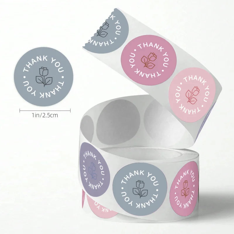 A roll of pastel rose thank you stickers featuring the text Thank You.
