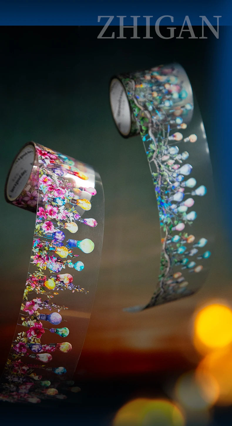 A roll of decorative PET washi tape featuring floral and botanical elements, shown against a dark background.