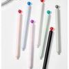 A collection of smooth gel pens in various colors including pink, white, green, purple, and black, shown vertically.