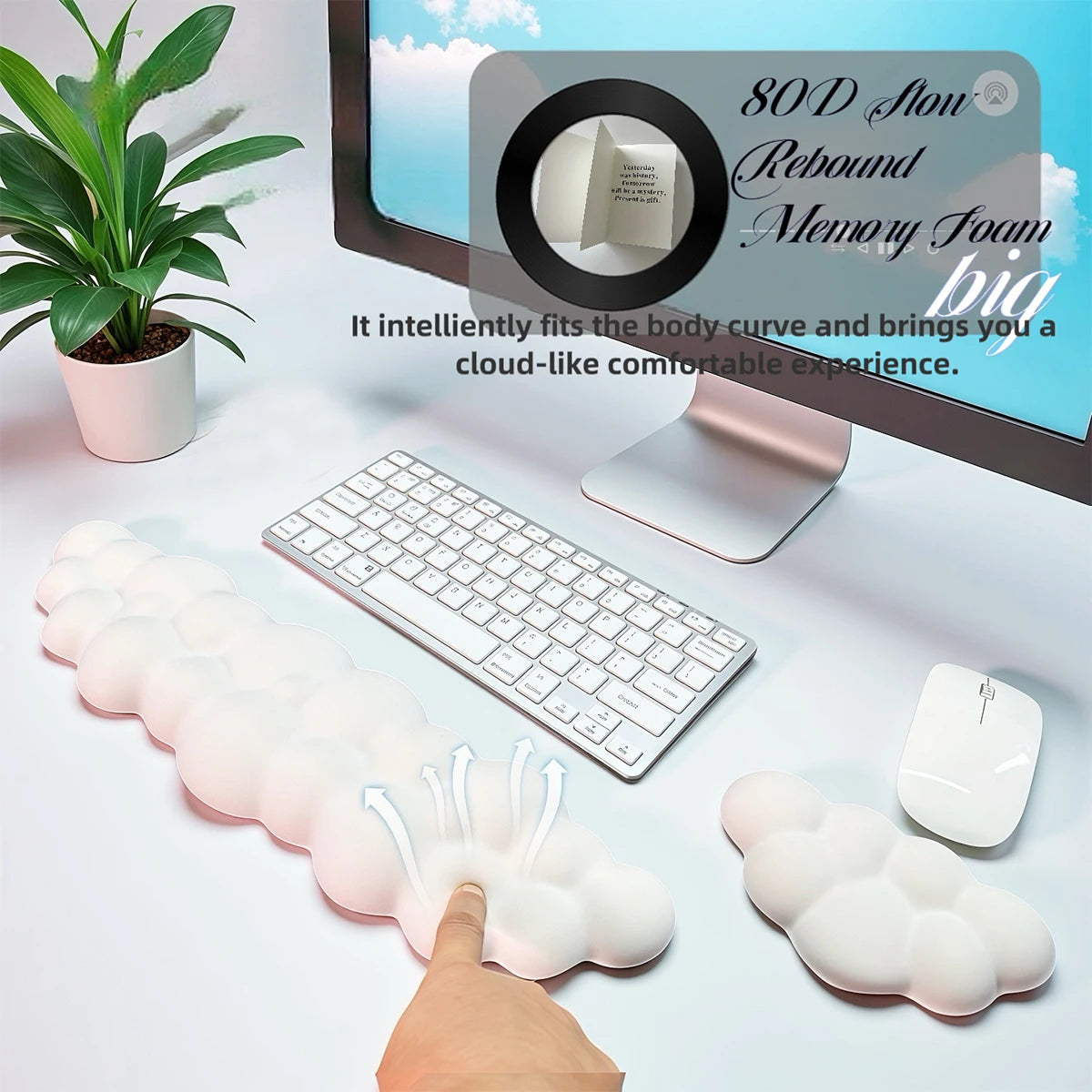 A white ergonomic memory foam wrist rest pad is shown next to a computer keyboard and mouse on a desk.