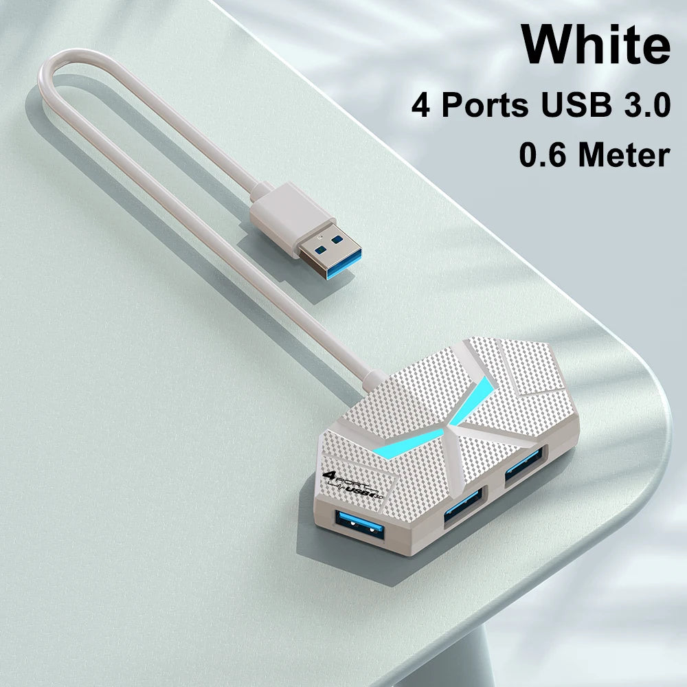 White USB 3.0 multi-port hub with four ports and a 0.6 meter cable shown on a table.