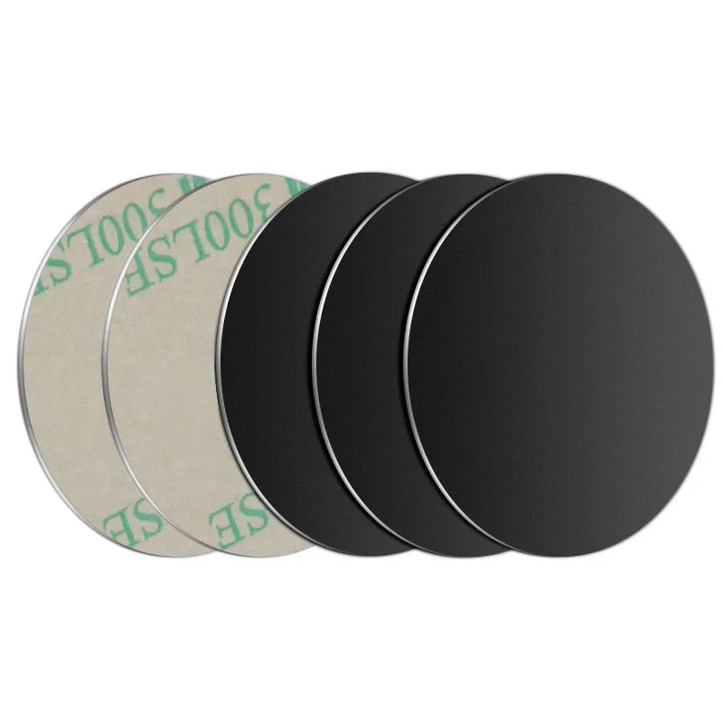 A set of five round magnetic mount plates for phones and devices in various shades of gray and black.