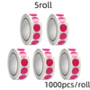 Roll of 5roll round dot labels with pink and white colors for organization