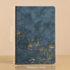 A dark blue luxury PU leather notebook set featuring gold foil illustrations of mountains, pagodas, and flowers.