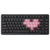 A black mechanical gaming keyboard with pink keycaps and various function keys is shown from the top view.