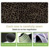 A close-up of a brown and black leopard print mouse pad showing the texture and stitching details.