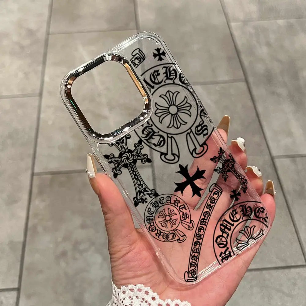 A hand holds a clear holographic gradient phone case featuring intricate black gothic and religious symbols.