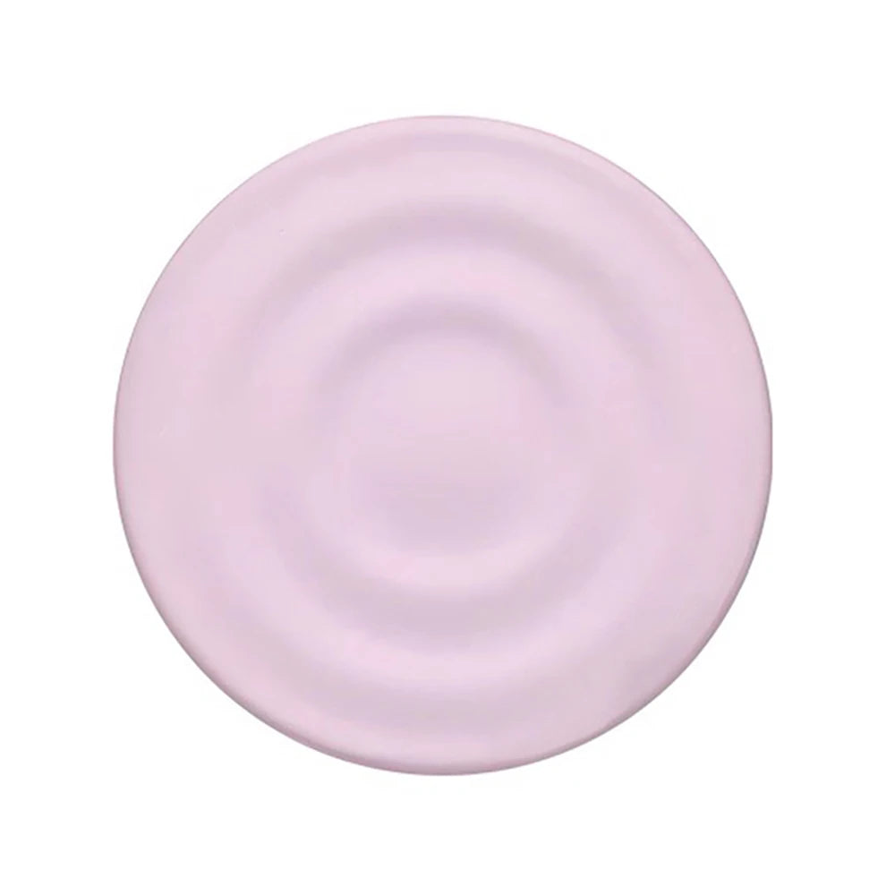 A round, matte lilac silicone ripple grip magnetic phone stand.