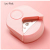 A pink precision corner cutter tool with a hinged design shown from above.
