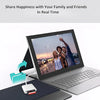 A laptop displaying a video call of family and friends, with a card adapter nearby.